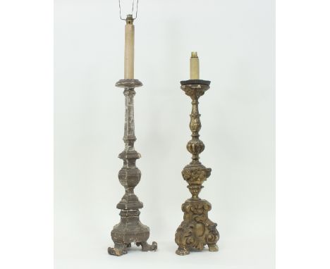 A 17th century style Italian carved and silvered altar candlestick, turned on a triform base, converted for electricity, 80cm