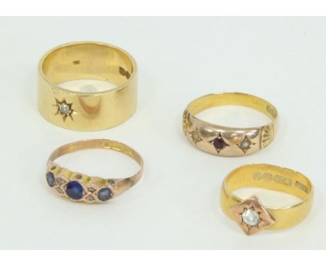 A 22ct gold ring set with a single diamond, an 18ct gold band set with a single diamond and two gold dress rings