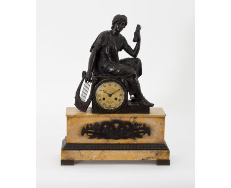 An early 19th Century French mantel clock, with silk suspension eight-day movement striking on a bell, within a Siena marble 