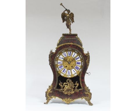 A boulle work mantel clock, surmounted by a figure of a winged angel, the dial with blue enamel numerals in an hourglass shap