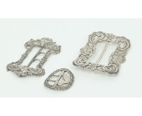 A late Victorian silver buckle, ST Birmingham 1892, chased and engraved mask heads, scrolls etc., another, WC, London 1898 an