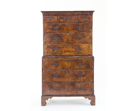 A George II walnut chest-on-chest, the top with moulded cornice, fitted three long and three short drawers, the base of three