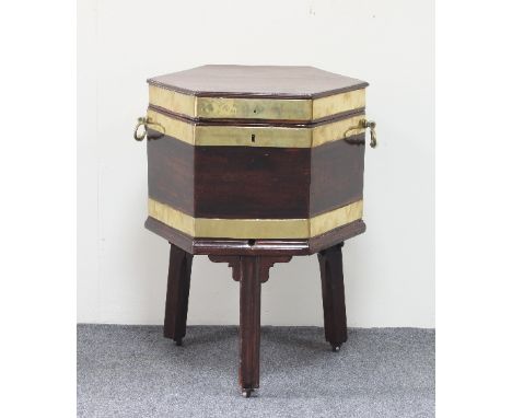 A George III hexagonal mahogany and brass bound wine cooler, circa 1780, with ring handles and brass tap, on square moulded l