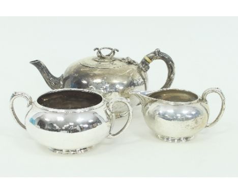 A Victorian circular silver tea service, Samuel Selim, London 1889, the teapot with rope finial and C scroll handle, approxim