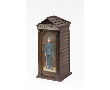 A fine late Victorian letter box, with slatted sides and gable roof, the door painted with a sentry, the hinged metal slot in