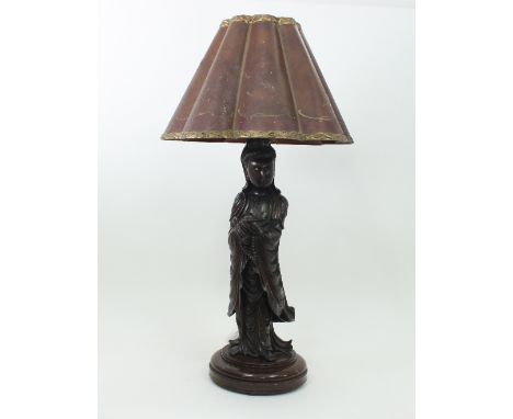A carved and inlaid wood figure of a Goddess on a circular base of a lamp complete with shade, 94cm high Condition Report: Cr