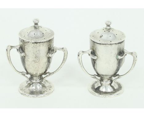 A pair of Arts and Crafts silver three-handled pepper pots, John Thomas Heath & John Hartshorne Middleton, Sheffield, 1904, t