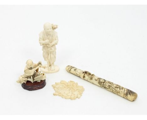 A Japanese ivory okimono, Meiji period, depicting a seated tradesman, on a wooden plinth, 9cm high, another depicting an old 