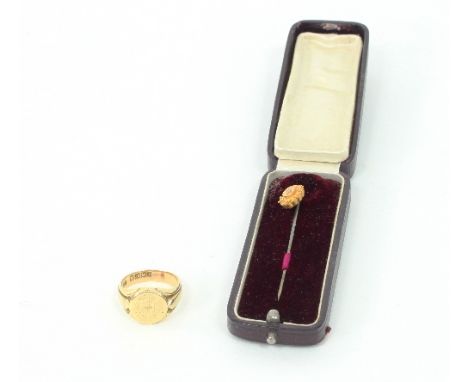 An 18ct gold signet ring, approximately 13.5gm and a tie pin, the 15ct gold oval terminal centred by a small diamond Conditio