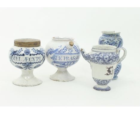 An Italian 17th Century albarello for Vno. Plumb, damages, 21.5cm high, an Italian wet drug jar for Syr. Niofra, circa 1800, 