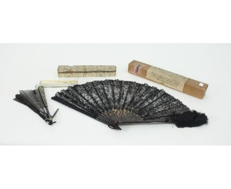 A faux mother-of-pearl fan, the fitted box marked J Duvelleroy, Paris, a faux tortoiseshell and lace fan and a small faux ivo