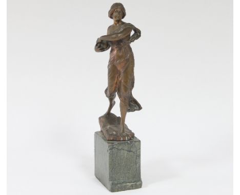 A French Art Nouveau bronze figure of a girl with a ball on a marble base, 40cm high