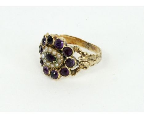 A Georgian gold, amethyst and half pearl ring, close set with a cluster of circular cut amethyst and half pearls/Provenance: 