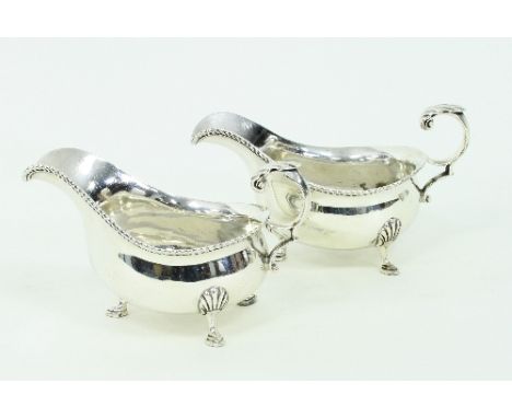 A pair of silver sauce boats, GH, Sheffield 1926, with gadrooned rims, approximately 300gm/Provenance: Chambers Court, Glouce