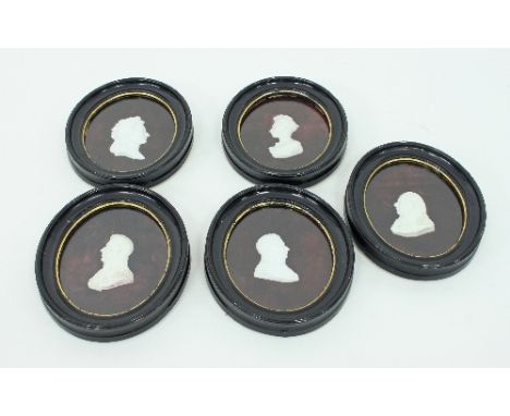 A set of five Sèvres bisque silhouettes of George III, Queen Charlotte, George IV and two others in oval frames, supplied by 