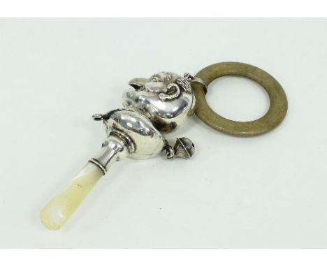 A child's silver rattle modelled as Mr Punch, Birmingham 1933, with mother-of-pearl handle and a teething ring/Provenance: Le