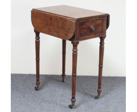 A small mahogany Pembroke work table, circa 1820, the two-flap top above a single drawer on ring turned tapering legs, 51cm w