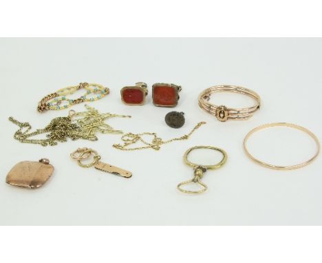 A collection of jewellery, including a plain gold bangle marked .585, a 9ct gold vesta case engraved 'from Spotty'; a 9ct gol