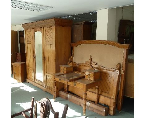 A Victorian pitch-pine bedroom suite, comprising wardrobe with scale carved cornice, 196.5cm wide, a pair of bed-ends with ca