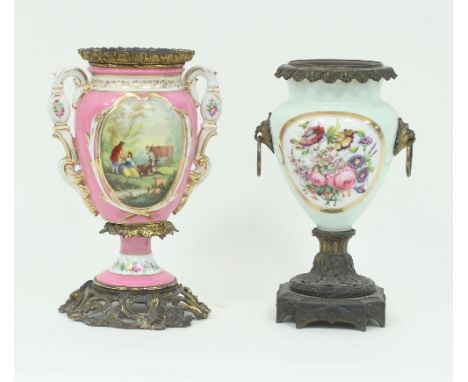 A Victorian gilt metal mounted oil lamp base, 34cm high and another with floral decoration on a pink ground, 35cm high