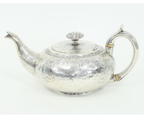 A George III silver teapot, Hannah Northcote, London 1804, of compressed circular form, crested and engraved with pagodas, th