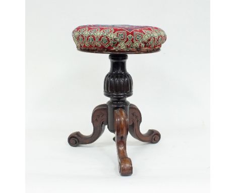 A Victorian mahogany piano stool with circular adjustable top on a reeded column and tripod support, the top 37cm diameter