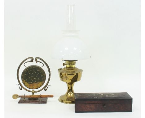 A brass oil lamp with opaque glass shade and chimney, a brass gong and an inlaid trinket box