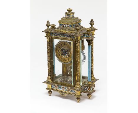 A French gilt brass and champlevé enamel four-glass striking mantel clock, circa 1890, with turned finials to the breakfront 