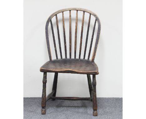 A stick back Windsor chair, circa 1800, in ash and elm with traces of the original paint Condition Report: Frame and splats b