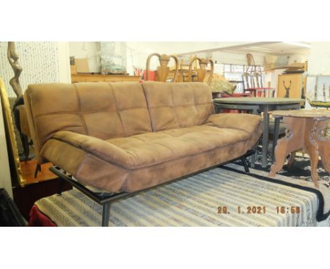 A brown hide sofa bed, stressed leather