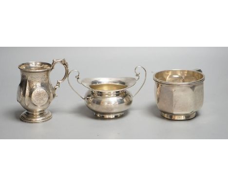 A Victorian silver christening mug, Birmingham, 1874, a later silver mug and a two handled sugar bowl,10oz.