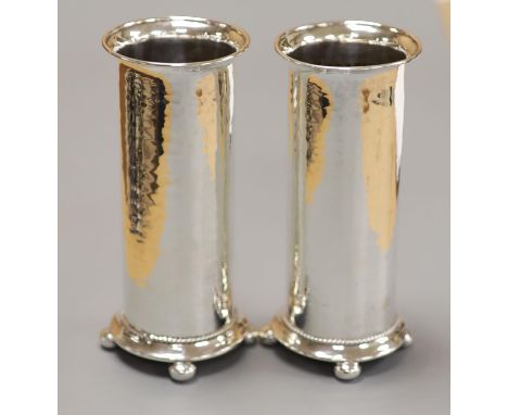 A pair of George V Arts &amp; Crafts silver cylindrical posy vases by Albert Edward Jones, Birmingham, 1917, 14.7cm, 8oz.