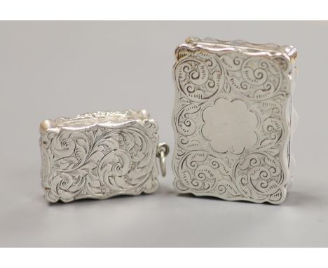 Two Victorian silver shaped rectangular vinaigrettes, Thomas Dones, Birmingham, 1855, 23mm and Colen Hewer Cheshire, Birmingh