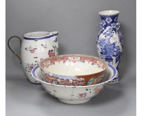 A Chinese Jiaqing export porcelain toilet jug and basin, a small punch bowl, and a blue and white vase (all a.f.) 31cm