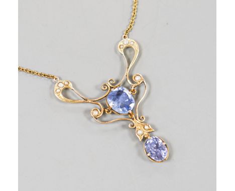 An early 20th century 9ct, two stone Ceylon sapphire and multi seed pearl set pendant necklace, pendant 49mm, chain approx. 4