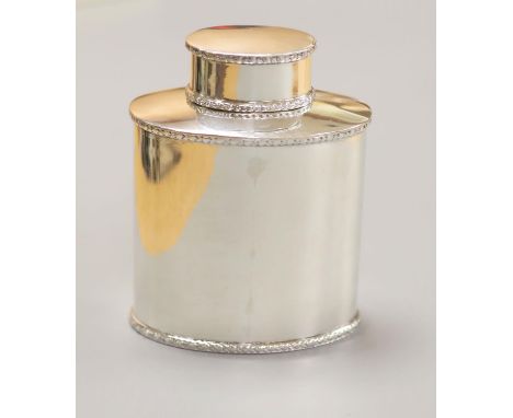 A George V silver oval tea caddy, Birmingham, 1923, 10.1cm, 122 grams.