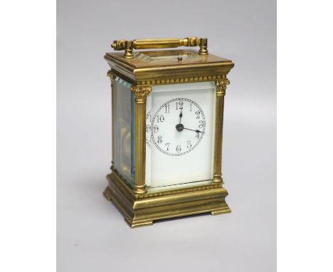 An Edwardian Corinthian brass repeating carriage clock, 20cm high to handle