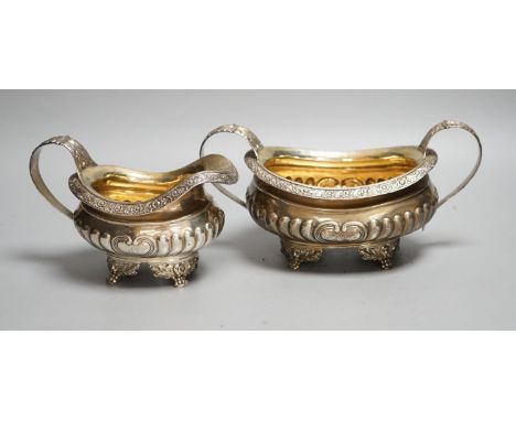 A late George III silver sugar bowl and cream jug, Robert Smeaton, Edinburgh, 1819, gross 19oz.