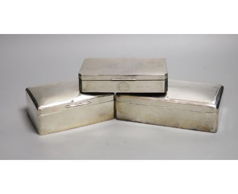Three silver mounted cigarette cases, largest 17.9cm.