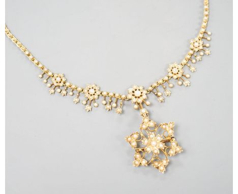 An Edwardian 15ct and seed pearl set pendant/brooch necklace, 44cm, gross weight 23.2 grams.