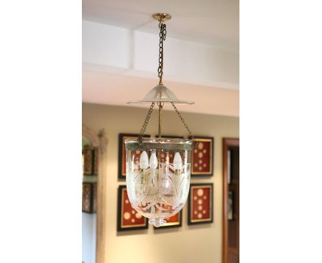 A cut and etched glass hurricane style ceiling light, height 54cm diameter 30cm, fitted for electricity