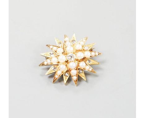 An Edwardian yellow metal, graduated split pearl and single stone diamond set starburst brooch(adapted?), 24mm, gross weight 
