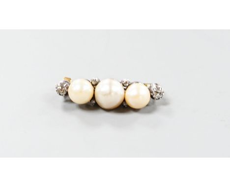 A yellow metal, three stone cultured pearl and six stone diamond brooch, 34mm, gross weight  8.1 grams.