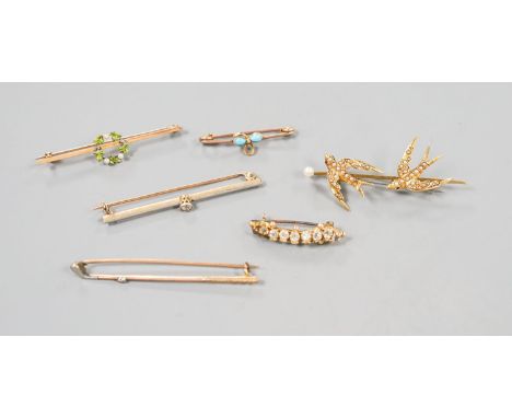 A collection of six assorted yellow metal bar brooches, including seed pearl set twin swallow, diamond set gold club and soli