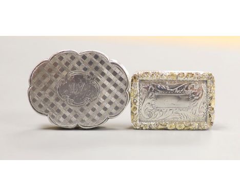 Two Nathaniel Mills silver vinaigrettes, cusped oval shape, 34mm Birmingham, 1849 and gilt border, Birmingham, 1834.