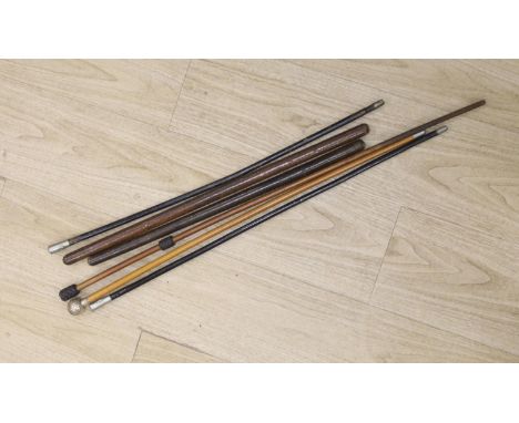 A silver topped RAMC swagger stick, a leather stiletto swagger stick and four other swagger sticks or riding sticks