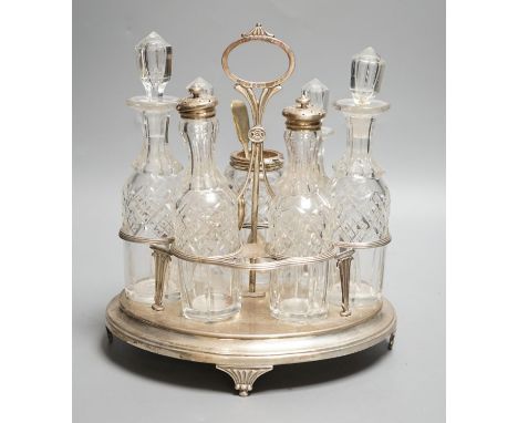 A George III silver oval cruet stand, Henry Nutting, London, 1805, height 25cm, 17.5oz, with six later associated glass bottl