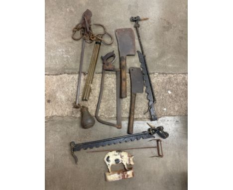 An assorted collection of butchers tools 