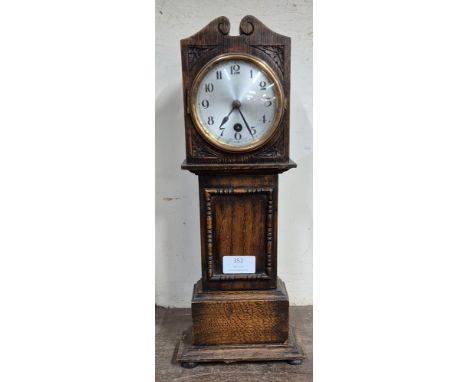 An early 20th Century oak miniature longcase clock time piece 