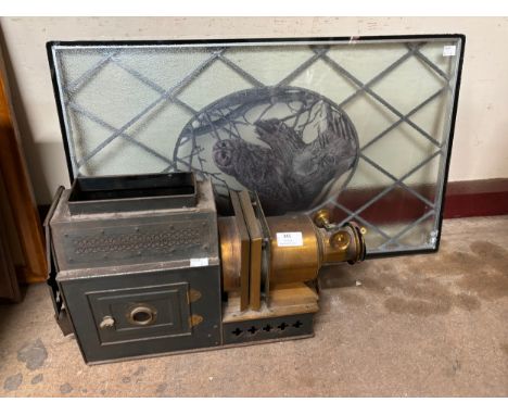 A stained glass window and a magic lantern projector 
